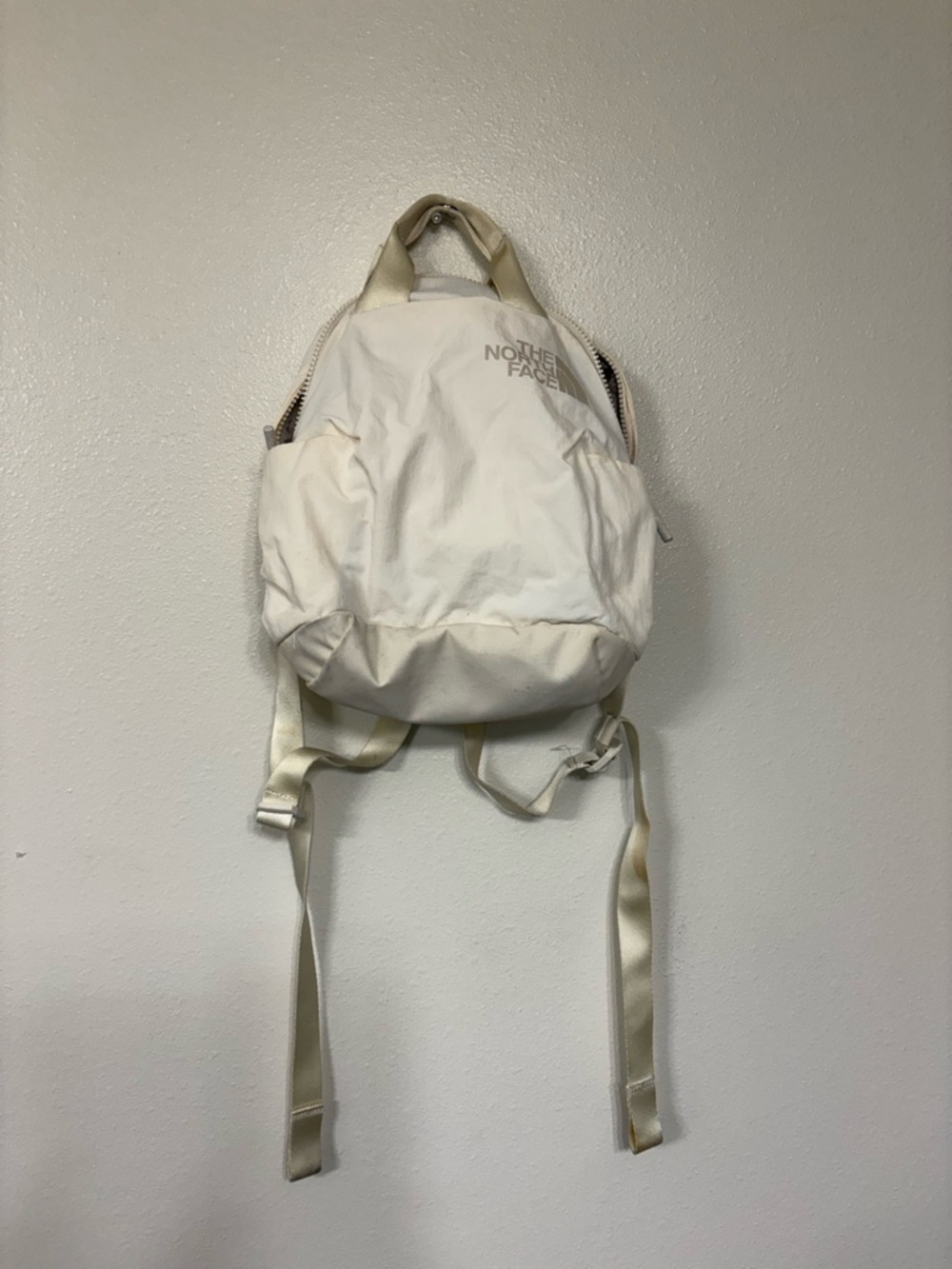 The North Face Cream Mini Daypack